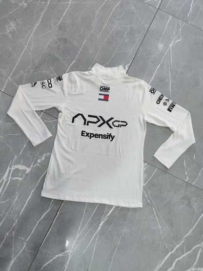 White long-sleeve shirt with branding on a gray surface