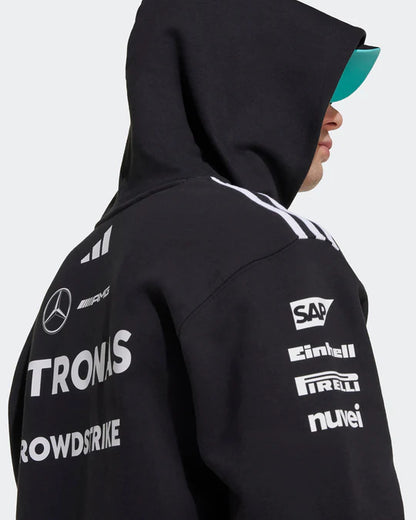Men wearing official Mercedes F1 Team 2025 black hoodie - premium motorsport apparel