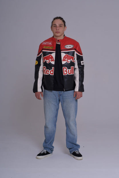 Person wearing a Red Bull branded jacket on a plain background