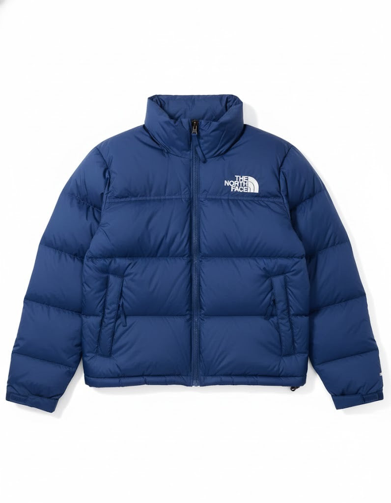 Blue puffer jacket with The North Face logo on a white background