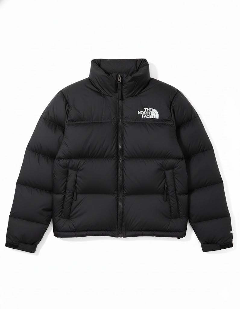 Black puffer jacket with The North Face logo on a white background