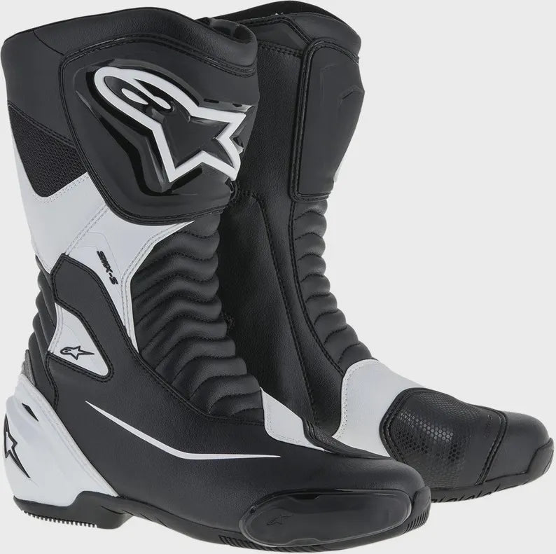 Black and white motorcycle boots with brand logo on a white background