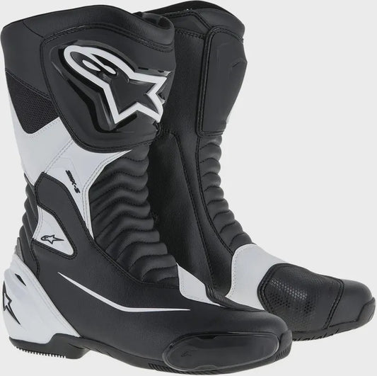 Black and white motorcycle boots with brand logo on a white background