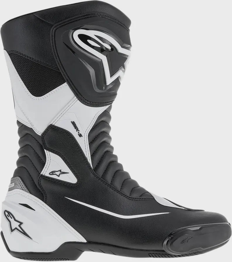 Black and white motorcycle boot with brand logo on a gray background
