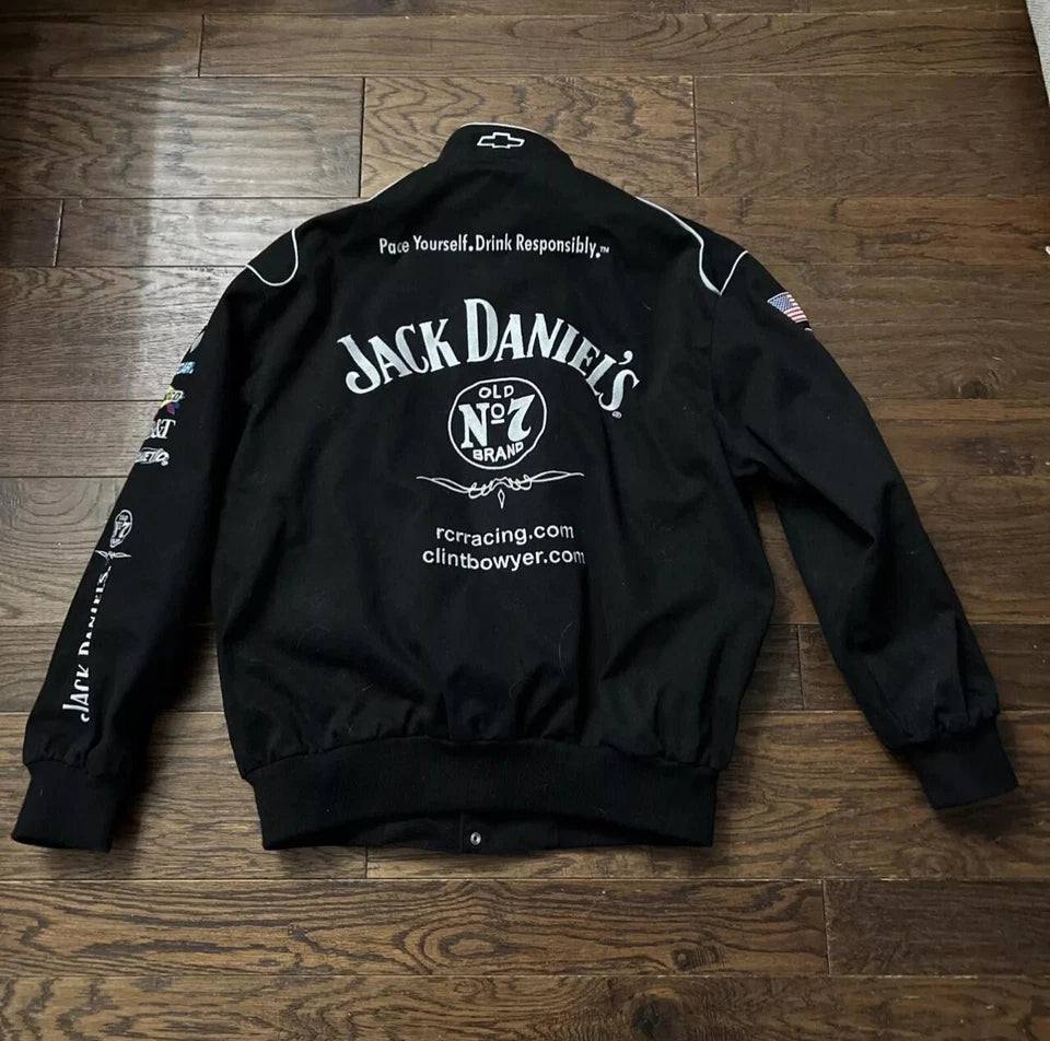 Black jacket with Jack Daniel's branding on a wooden floor