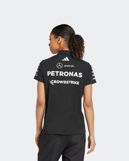 Woman Wearing Black 2025 Mercedes-AMG Petronas Replica Polo at a Formula 1 Event