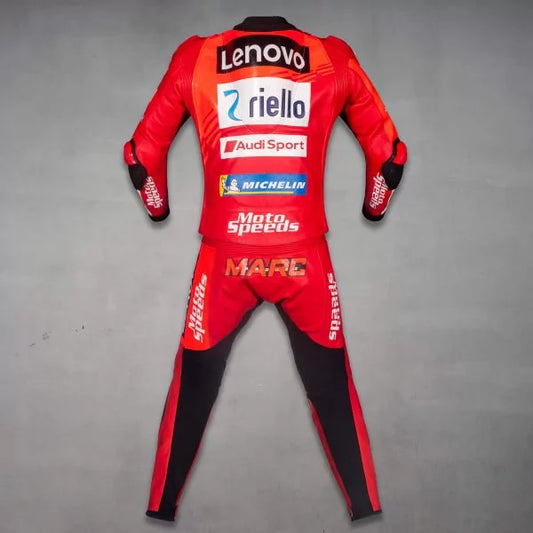 Red motorcycle racing suit with multiple brand logos on a gray background