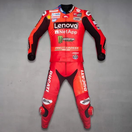 Red motorcycle racing suit with multiple brand logos on a gray background