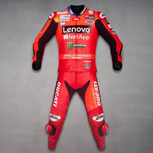 Red motorcycle racing suit with multiple brand logos on a gray background
